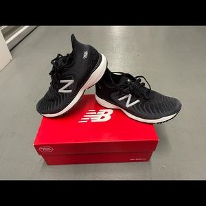 New Balance size 8.5W. And size 7 color black